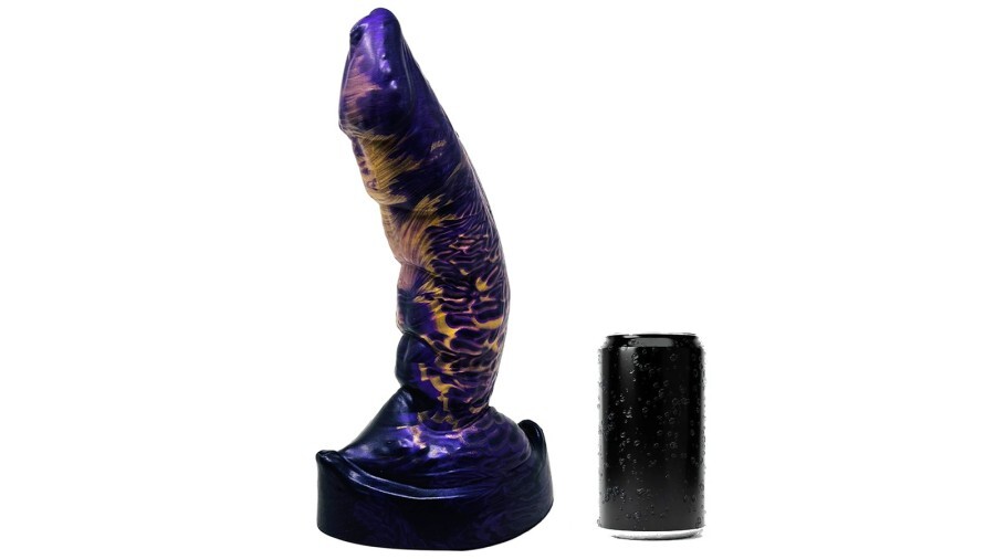 A purple dildo placed near a soda can for size comparison.