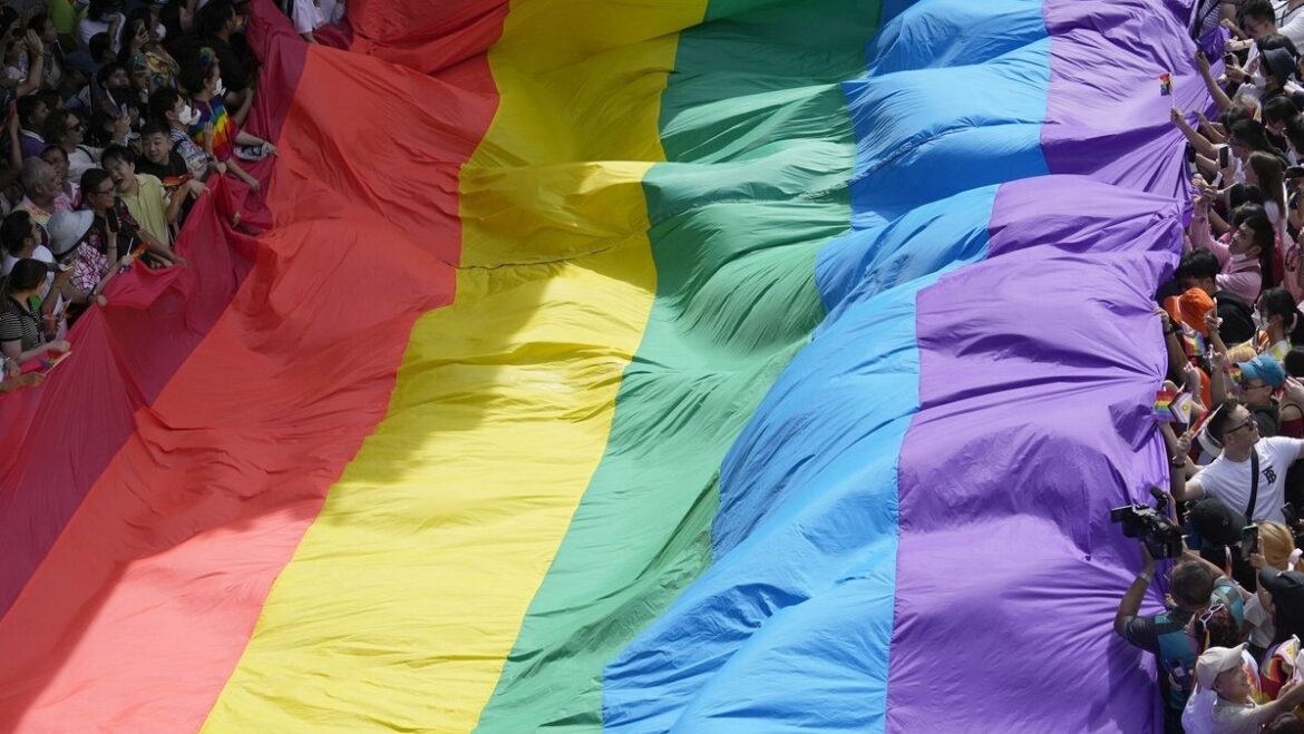Participants hold a rainbow flag during a Pride Parade in Bangkok, Thailand, June 4, 2023.